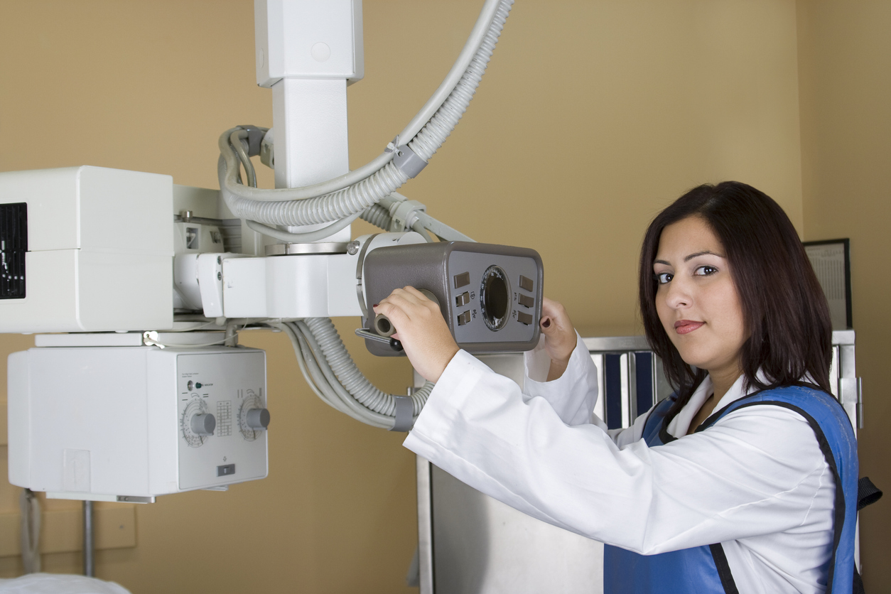 Hispanic Woman Technologist at X-ray Machine