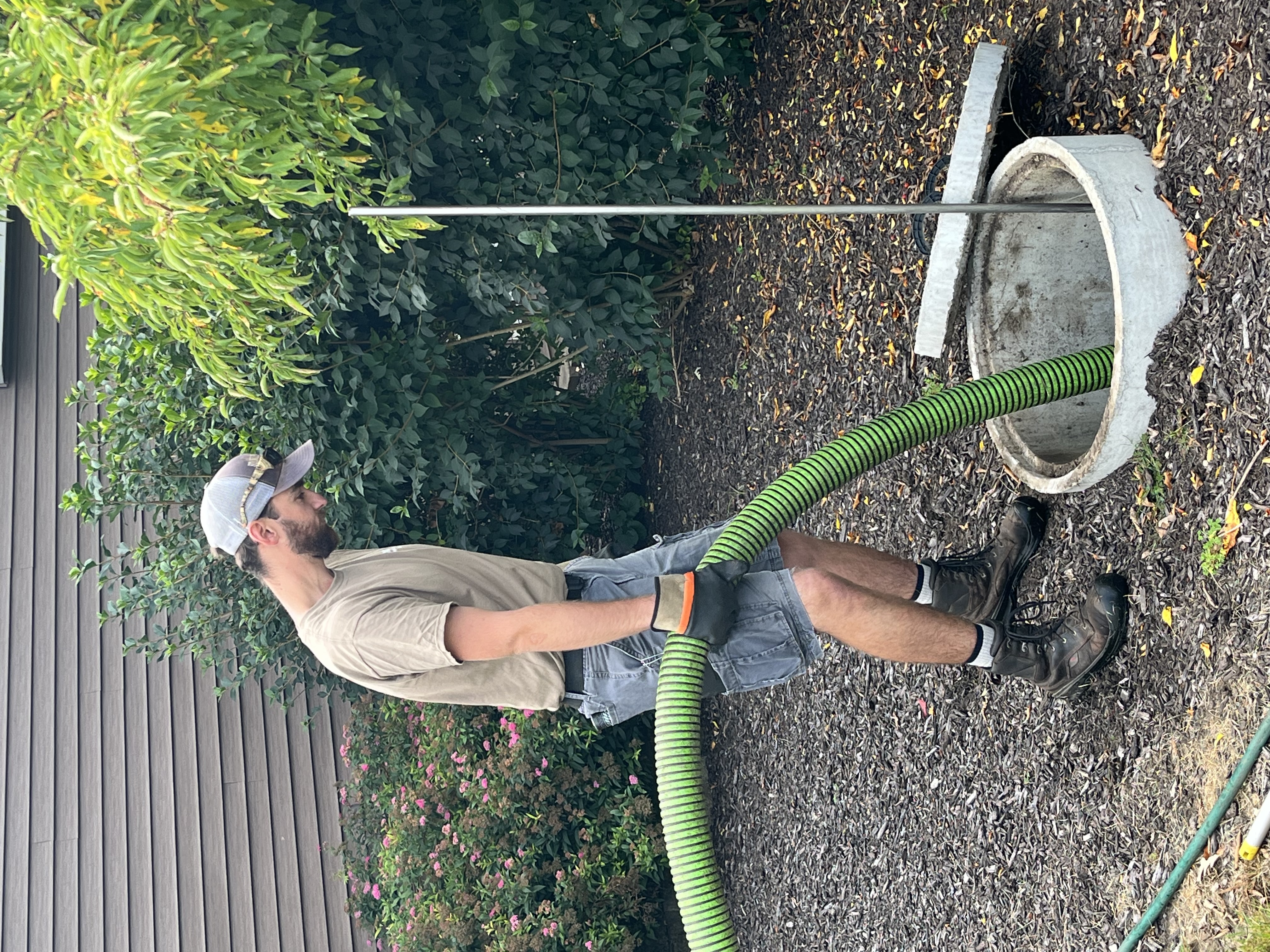 A septic professional cleans a Private Onsite Wastewater Treatment System (POWTS) in Wisconsin