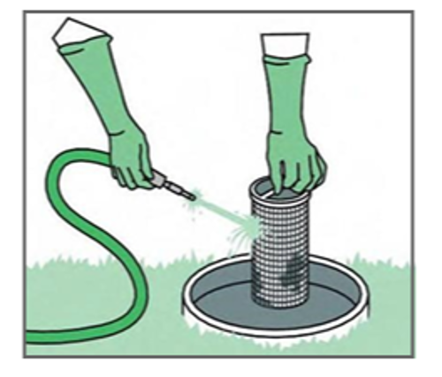 Effluent filter being held and sprayed down with a hose by gloved hands.