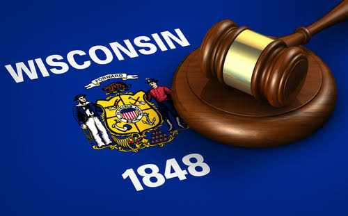 Image of a gavel over a Wisconsin flag