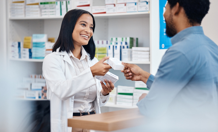 Female pharmacist helping man decide what pills to purchase his health. 