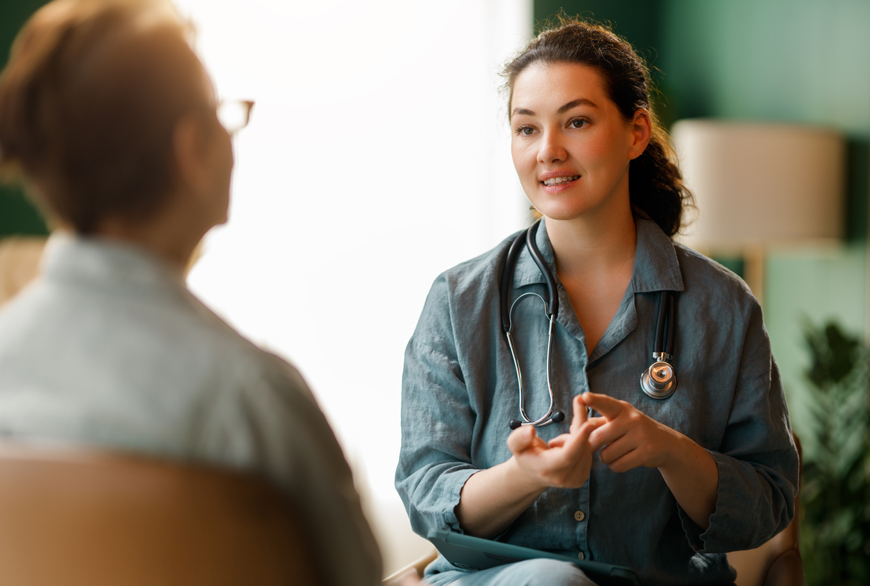 Female patient and a doctor talking. 

