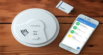 Image of a fire alarm system and a mobile phone