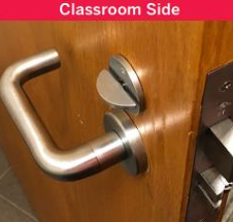 Image of a classroom side door with a interconnected lock. It has a latch lock and a lever handle.