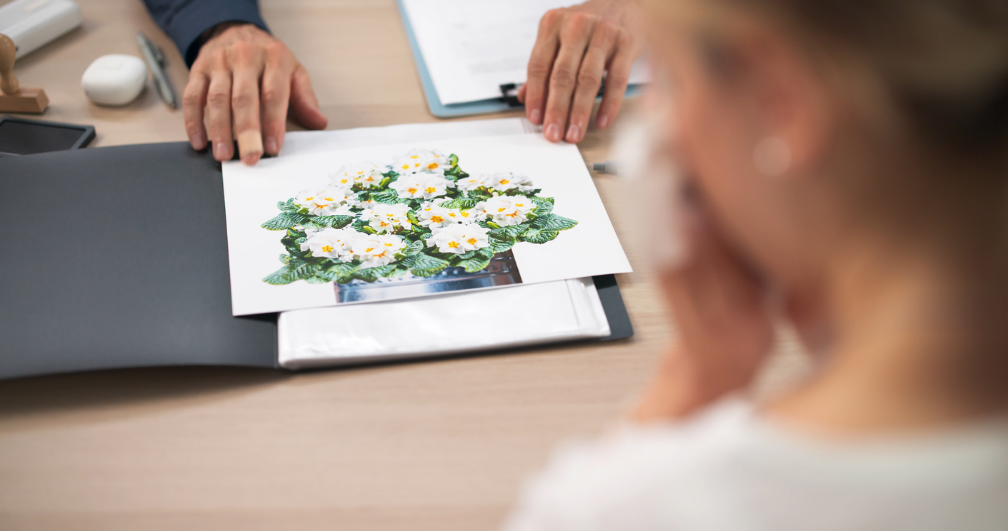 Funeral Director Supports Female Client Thoughtfully Planning Personalized Memorial Service.