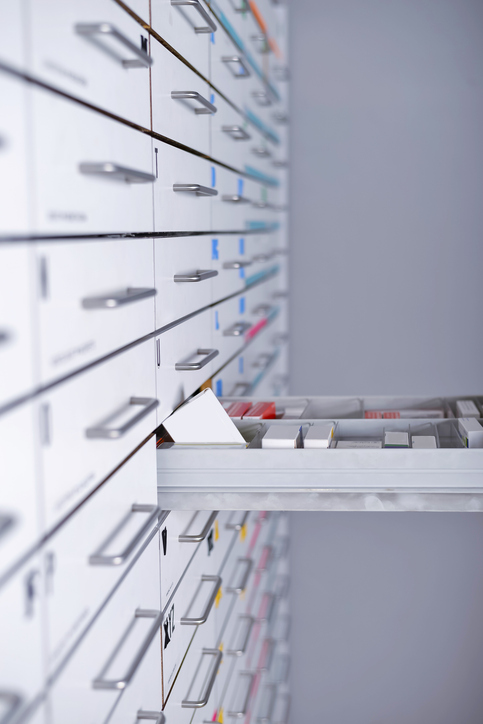 Pharmacy cabinet closeup from side of drawers.
